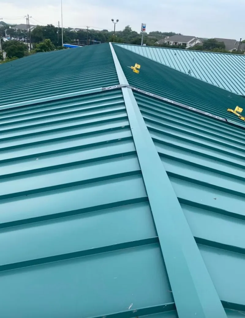 Green commercial metal roof ridge and valley for Metal Roof Repair in Chocolay
