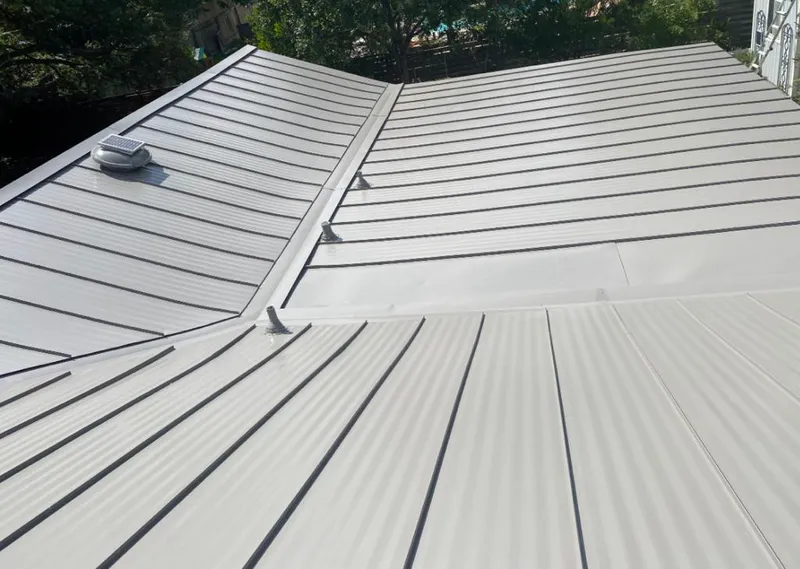 Solar attic fan installed on a metal roof for Roof Ventilation in Chocolay